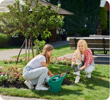 Two women planting